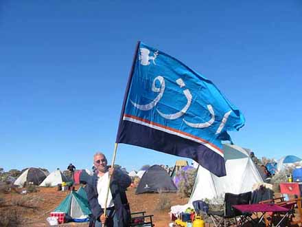 Stavros with Hope (in Farsi language) flag at the Baxter Camp.