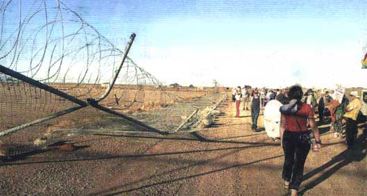 The first razor wire fence to fall on the way to supporting the refugees.